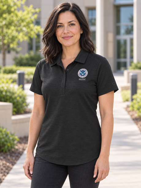 FLETC Women's Polo — Black lifestyle view
