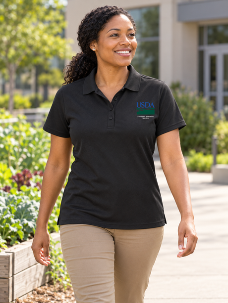 Food and Nutrition Service women's black polo lifestyle portrait