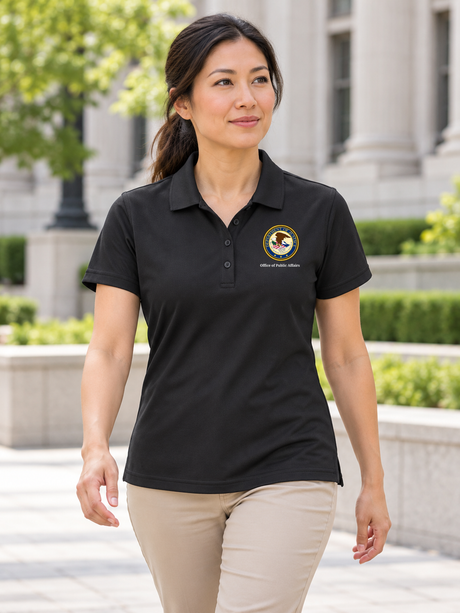 Office of Public Affairs women's black polo lifestyle portrait