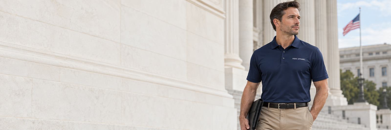 Professional wearing a navy FEDS Apparel polo outside a civic building